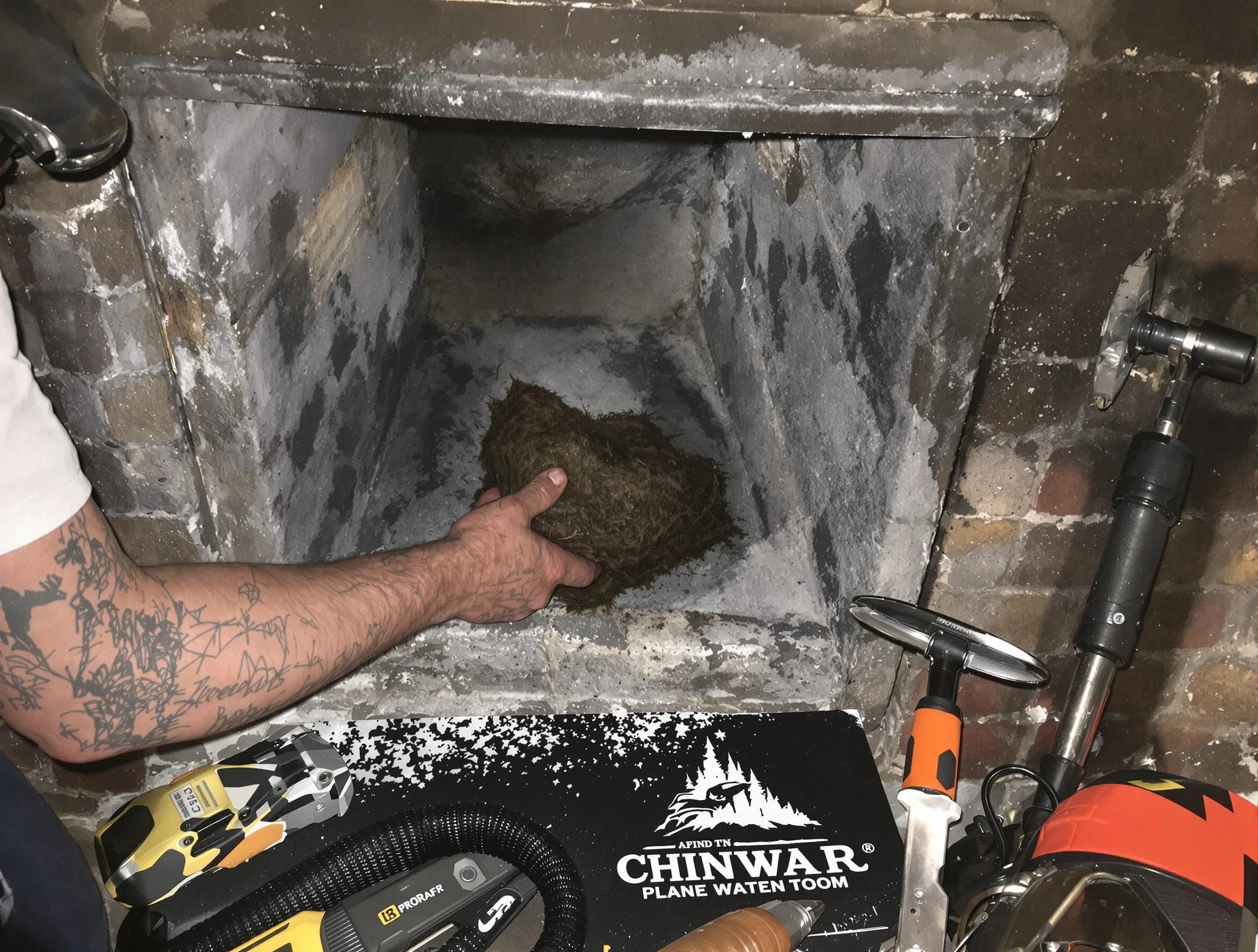 Dallas Chimney Sweep safely removing debris and screening chimney in Dallas, GA